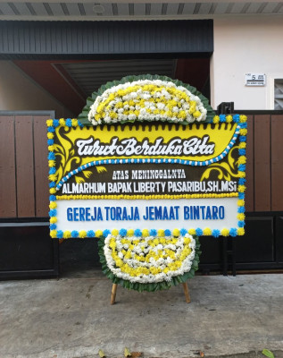 Papan Bunga Duka di Blokang